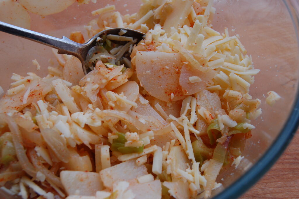 Add seasoning and cheese to vegetables