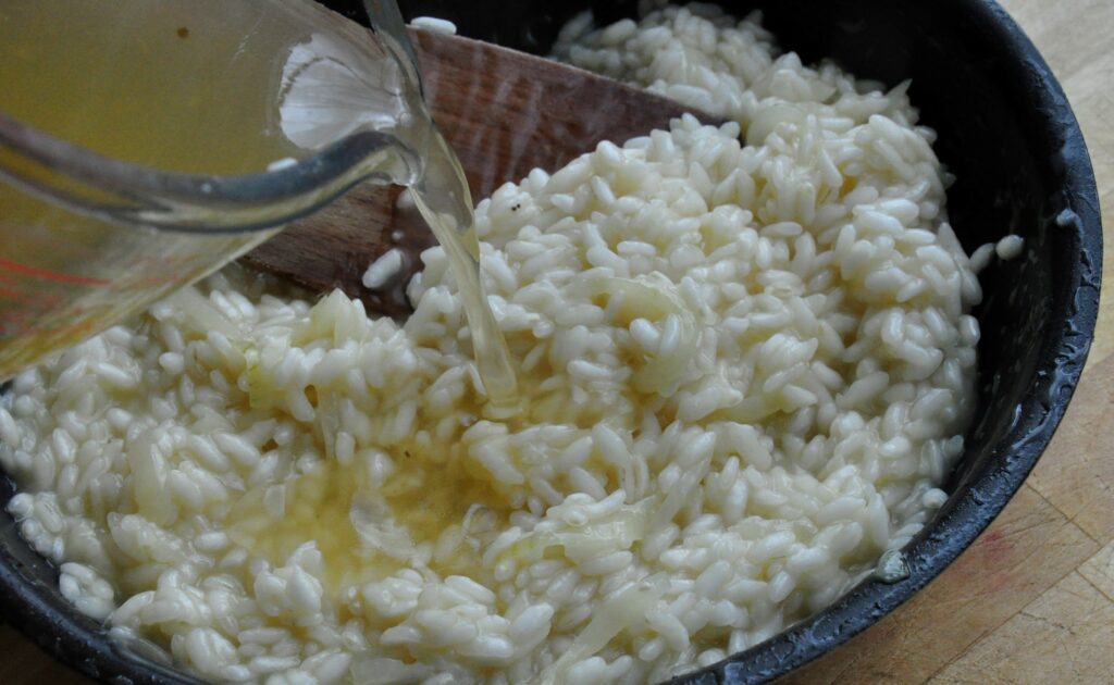 Asparagus risotto - slowly add staock