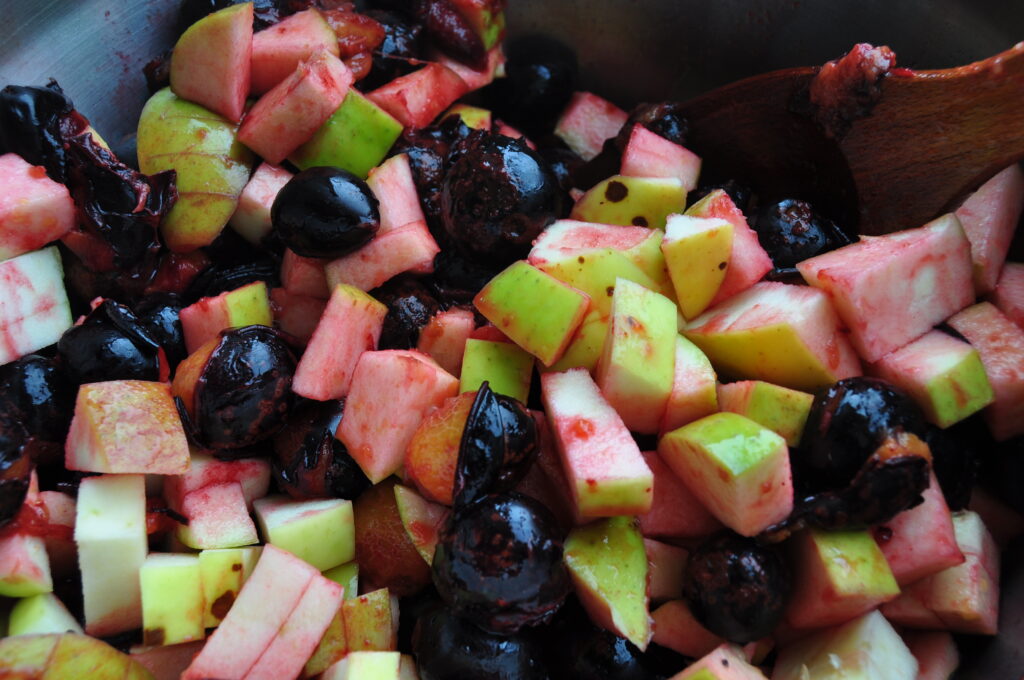 Damson & apple jam - mix the apples into the damsons