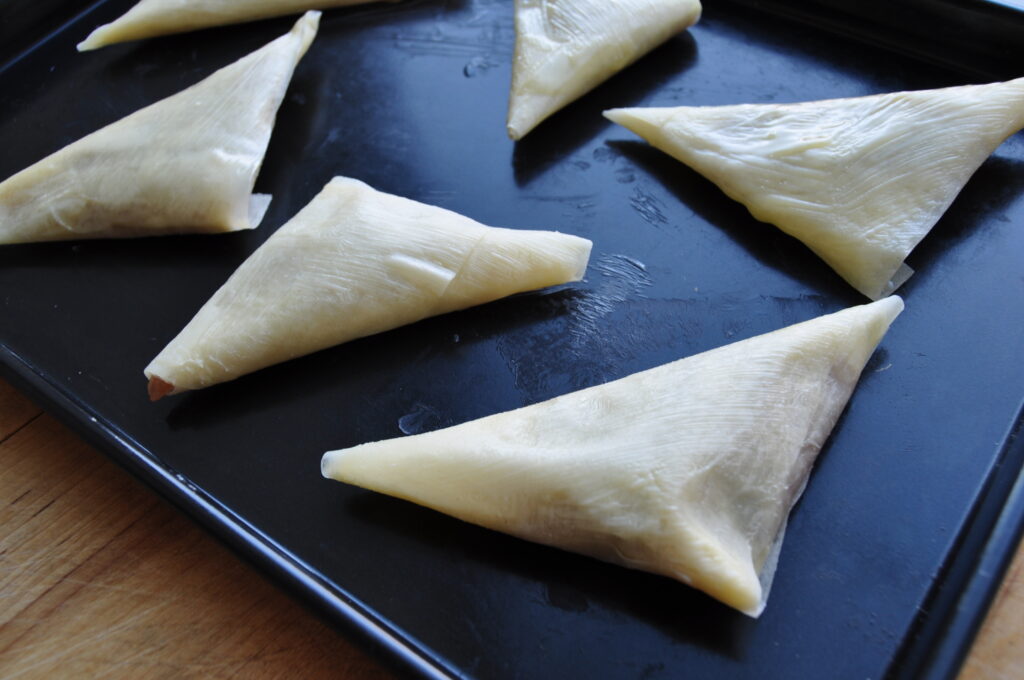Apple compote samosas = on baking tray