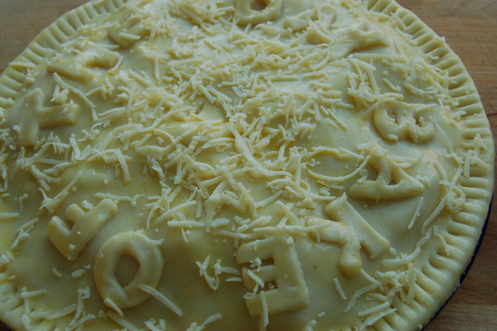 Decorate and scatter cheese over the top