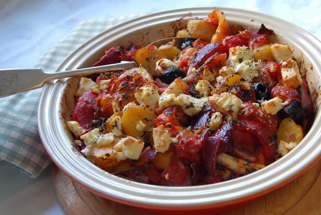 Herby new potatoes baked with feta, olives, tomatoes web